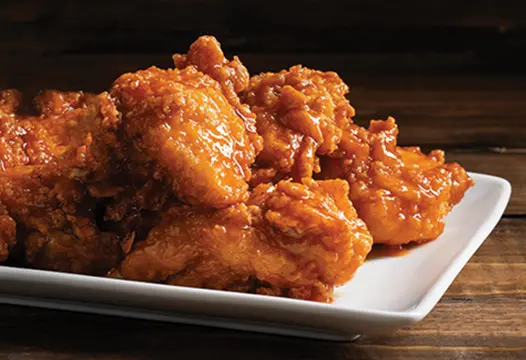 Crispy chicken wings tossed in sweet and spicy sauce