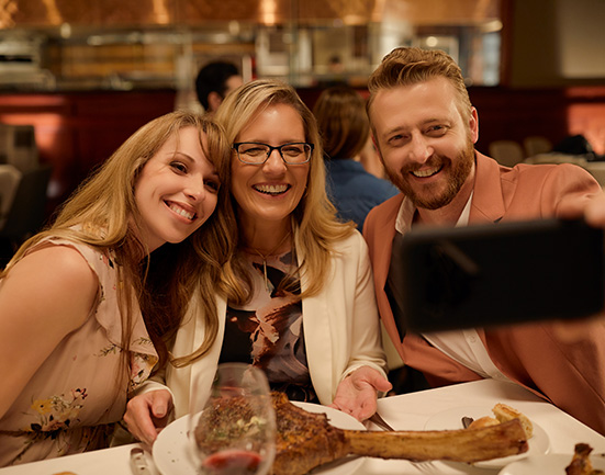 Mother's Day at Fleming's featuring a mom and her two grown adult children