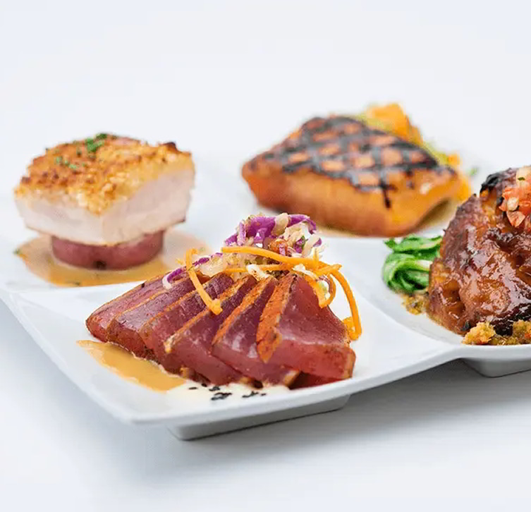 Plated assortment of prepared seafood dishes